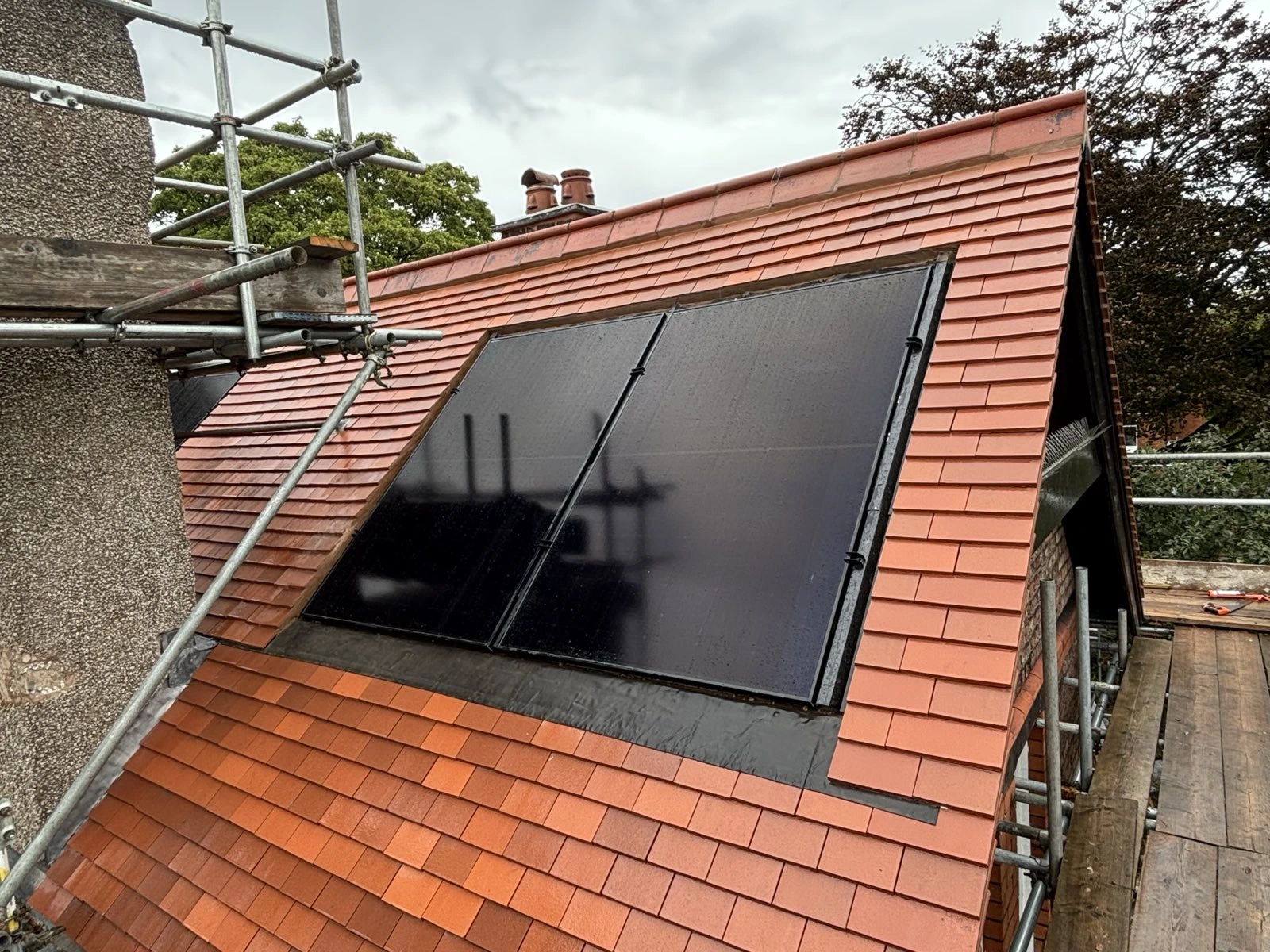 Integrated solar panels installed flush within a residential roof